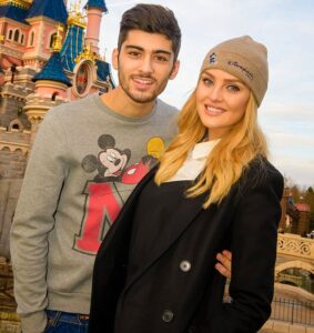 Caption Celebrity couple Zayn Malik and Perrie Edwards celebrate Zayns 21st birthday with a visit to Disneyland Paris. The Little Mix singer surprised her fiancé Zayn, with a magical getaway to the fairy-tale Disneyland Hotel, including a special visit from Disneyland Paris most famous resident Mickey Mouse. Their favourite attractions included Big Thunder Mountain and Peter Pans Flight as well as the parks night-time fireworks spectacular Disney Dreams. www.disneylandparis.co.uk